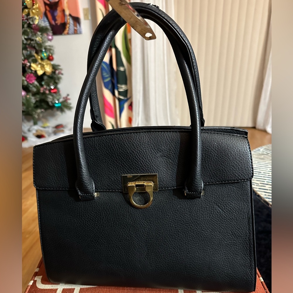 Black faux leather crossbody/handbag with gold hardware.